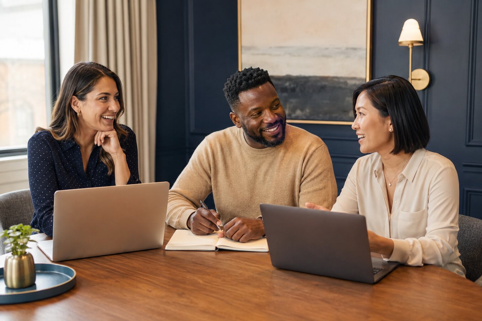 Three professionals collaborating around a conference table